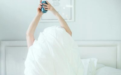 Woman stretching in sunlight during morning wellness routine at home